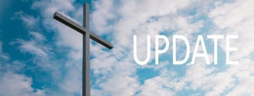 An image of a cross with the word update.